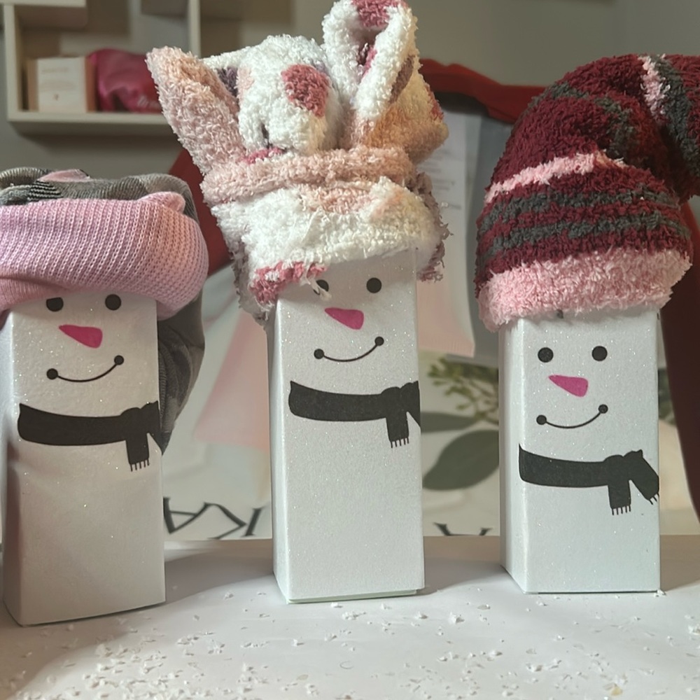 Mary Kay Energizing Foot & Leg Lotion and warm fuzzy socks. Packaged as snowman.